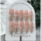 A272 The new almond-shaped nails with fishtail design and adorned with small pearls in light orange and white, accentuate a white and gentle appearance, all handcrafted."